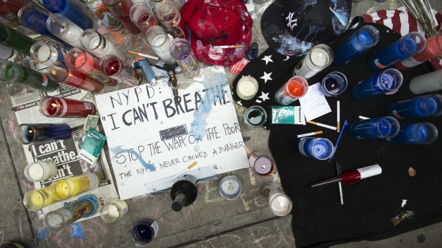 a memorial for Eric Garner rests on the pavement near the site of his death, in the Staten Island borough of New York