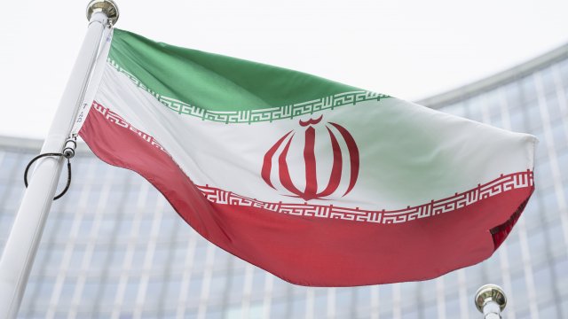The flag of Iran is seen in front of the building of the IAEA Headquarters.