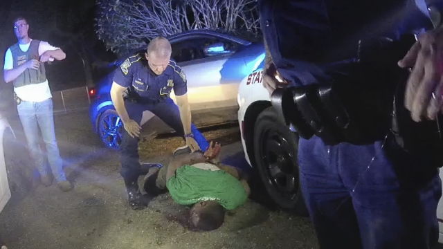 Louisiana State Trooper Kory York standing over Ronald Greene on his stomach on May 10, 2019.