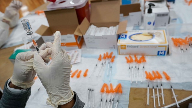 A nurse fills a syringe with the Johnson & Johnson COVID-19 vaccine
