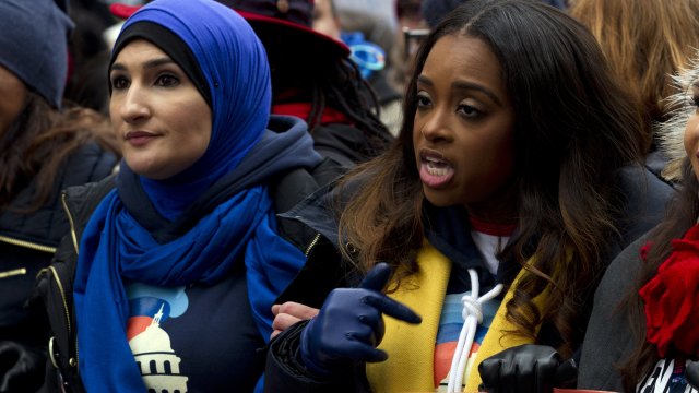 Tamika Mallory walks with others at Women's March in 2019