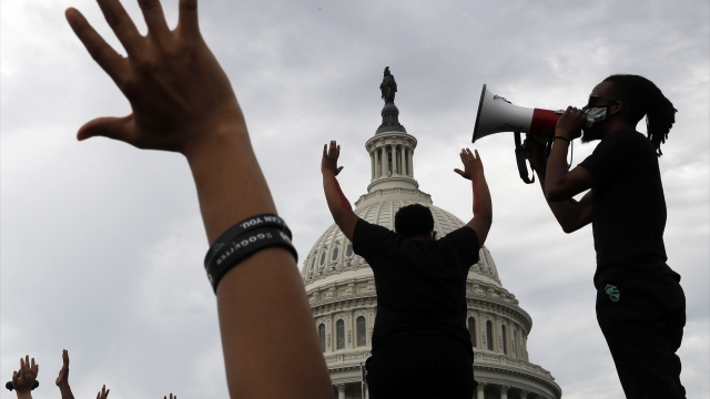 Demonstrators protest the death of George Floyd outside the U.S. Capitol in Washington.