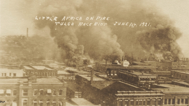 Postcard showing fires burning during the Tulsa Race Massacre