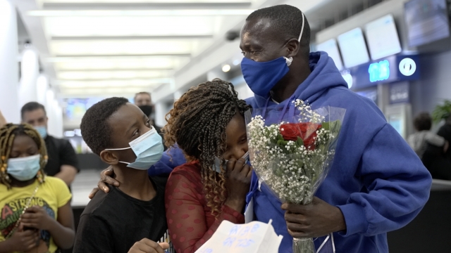 A Congolese refugee family reunites at Chicago's O'Hare airport after 5 years apart