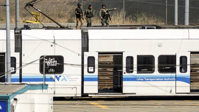 Law enforcement officers respond to the scene of a shooting at a Santa Clara Valley Transportation Authority