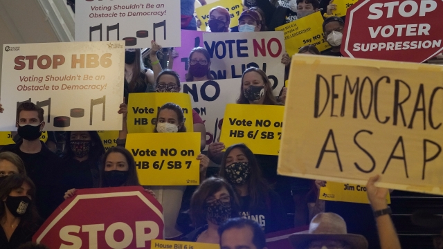 A group opposing new voter legislation gather outside the House Chamber at the Texas Capitol in Austin, Texas