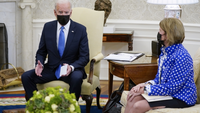 Sen. Shelley Moore Capito, R-W.Va., right, listens as President Joe Biden speaks during a meeting with Republican Senators