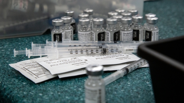 Doses of the Pfizer coronavirus vaccine seen being prepared.