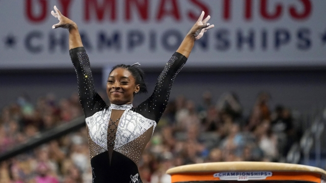 Simone Biles celebrates after competing in the vault during the U.S. Gymnastics Championships.