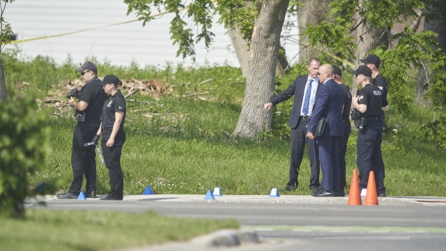Police investigate the scene of a car crash in London, Ontario