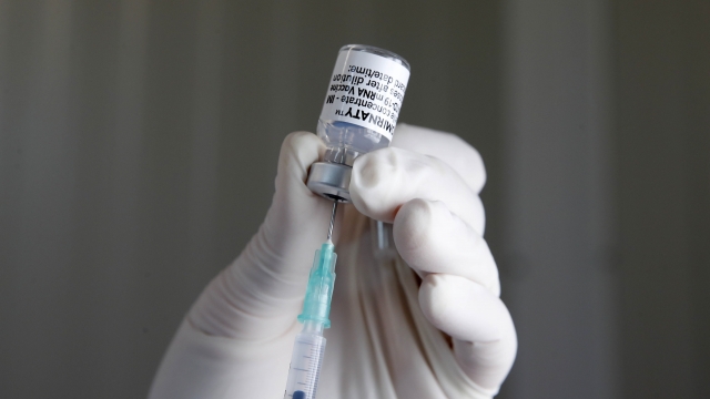 A nurse prepares a dose of the Pfizer-BioNTech COVID-19 vaccine