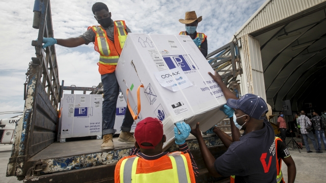 Boxes of COVID-19 vaccine provided through the COVAX global initiative arrive at the airport in Mogadishu, Somalia.