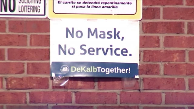 Sign outside Big Bear Supermarket reading "No Mask, No Service."