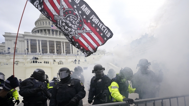 U.S. Capitol Police officers hold off rioters loyal to President Donald Trump at the Capitol in Washington.