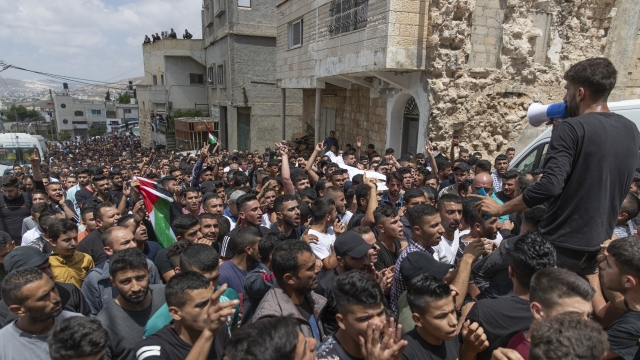 Palestinians mourn a 15-year-old boy killed by Israeli soldiers during protests in the occupied West Bank