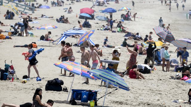 Beachgoers crowd in the heat at Santa Monica Beach on Wednesday, June 16, 2021, in Santa Monica, Calif.