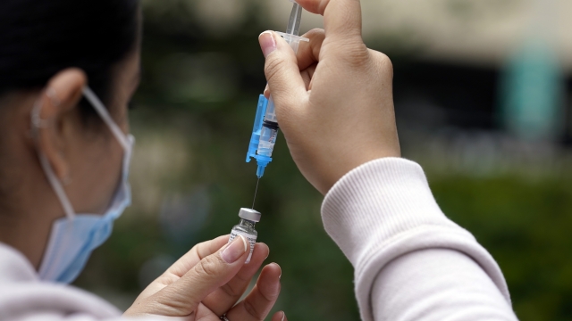 A shot of the Pfizer COVID-19 vaccine is prepared at the First Baptist Church of Pasadena in California.