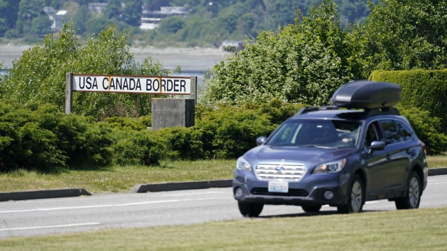 A car heads into the U.S. from Canada at the Peace Arch border crossing.