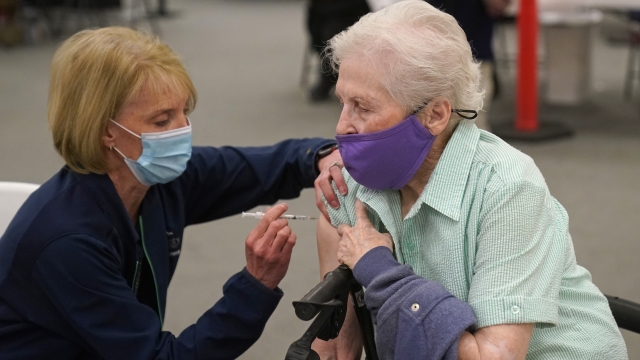 Marion Dickey, 83, receives her Pfizer vaccine in Utah.