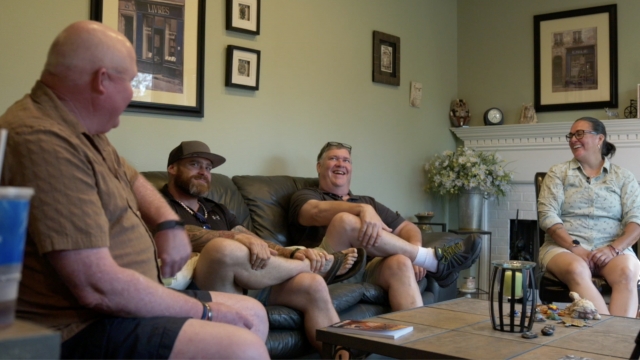Group sits on couch