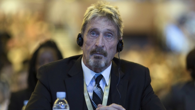 John McAfee listens during the 4th China Internet Security Conference in 2016.