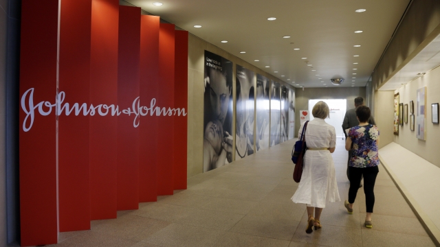 People walk along a corridor at the headquarters of Johnson & Johnson