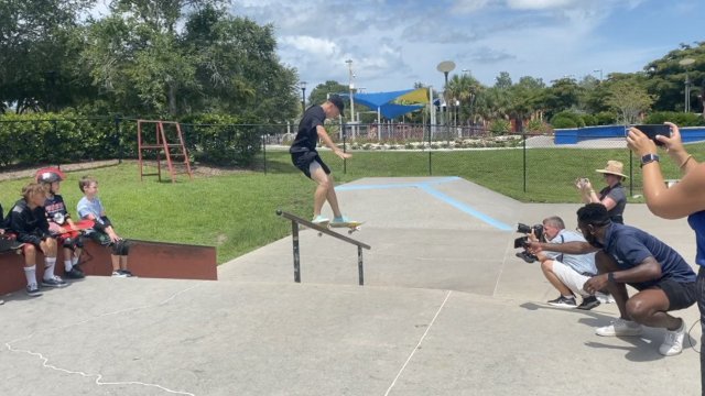 Man does a skateboard trick.