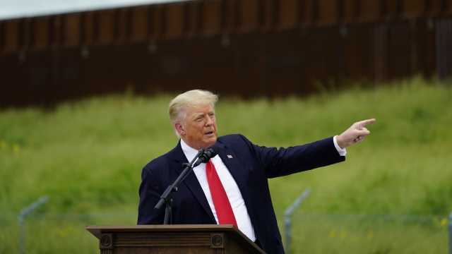 Former President Donald Trump speaks during a visit to an unfinished section of border wall.