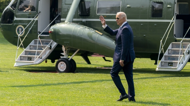 President Joe Biden waves before boarding Marine One on the South Lawn of the White House in Washington.