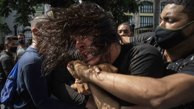 Plainclothes Cuban police arrest an anti-government protester