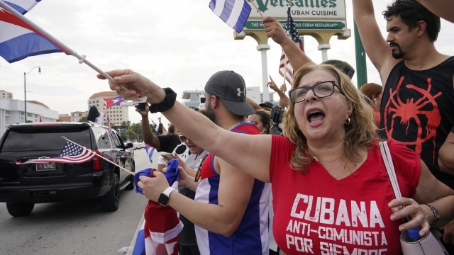 Cuban exiles rally at Versailles Restaurant in Miami's Little Havana neighborhood in support of protesters in Cuba.