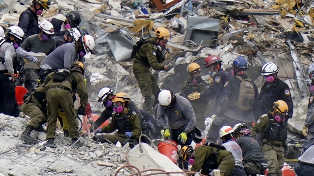 Crews from the United States and Israel work in the rubble Champlain Towers South condo