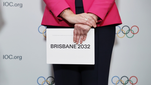 Woman holding the queue card after Brisbane was announced as 2032 Summer Olympics host.