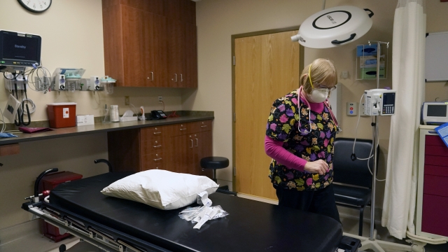 A registered nurse prepares an emergency room suite