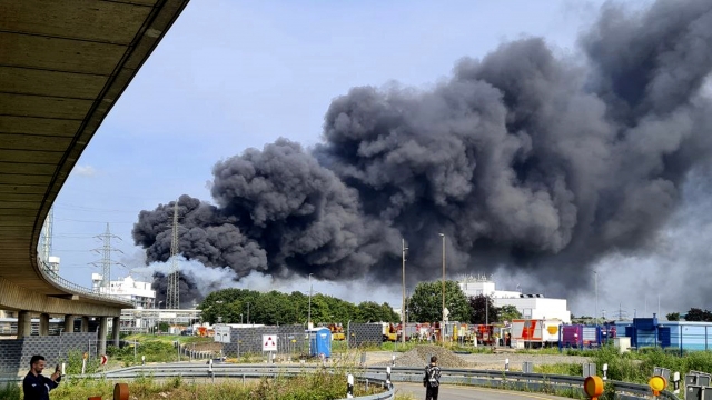 A dark cloud of smoke rises above the chemical park in Leverkusen, Germany,