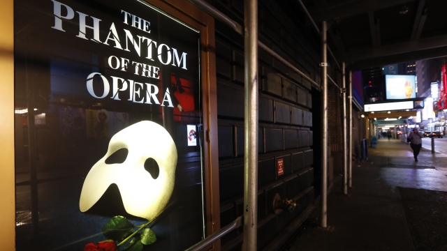 A poster advertising "The Phantom of the Opera" is displayed