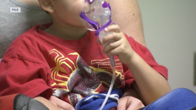 Child uses a breathing mask.