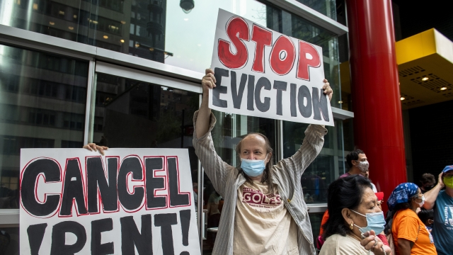 Housing advocates protest outside Governor Andrew Cuomo's office on the eviction moratorium
