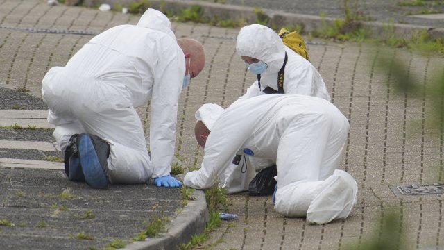 Forensic officers work in Biddick Drive in the Keyham area of Plymouth