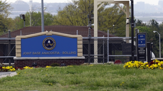 file photo shows the gate for the Anacostia-Bolling joint military base in Washington.