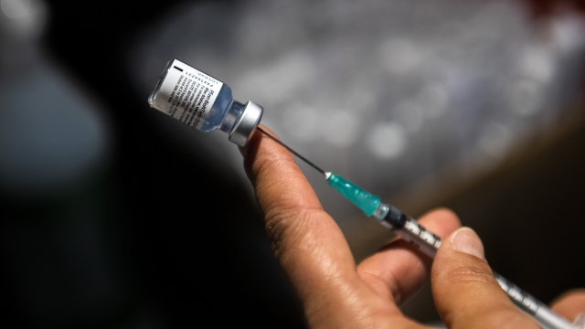 Health care worker prepares a shot of a COVID-19 vaccine.
