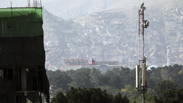 The Afghan flag remains on the presidential palace in Kabul, Afghanistan.