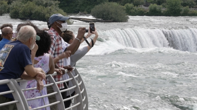 People look at Niagara Falls.