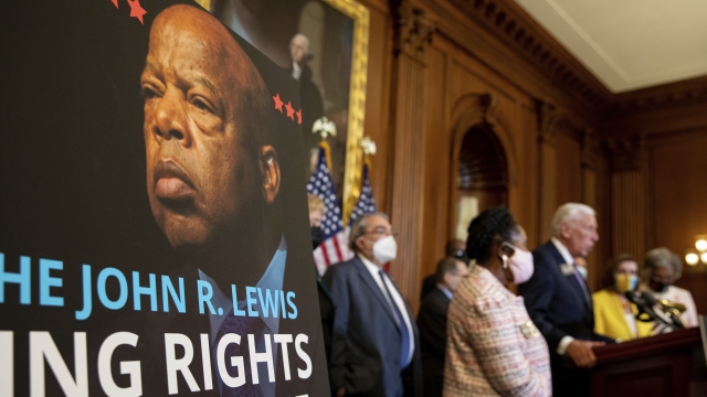 A poster bearing the image of voting rights icon John Lewis