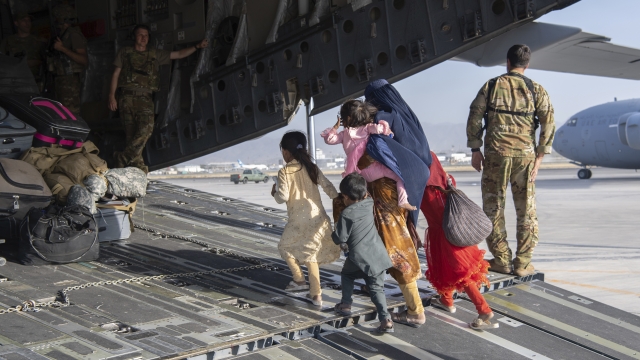 U.S. Air Force loadmasters and pilots load people being evacuated from Afghanistan to the U.S.