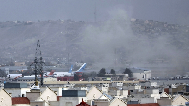 Smoke rises from a deadly explosion outside the airport in Kabul, Afghanistan, Thursday, Aug. 26, 2021.