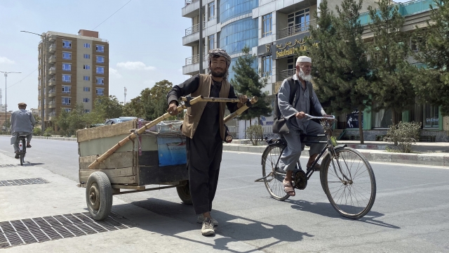 An Afghan man pushes a handcart in Kabul, Afghanistan.