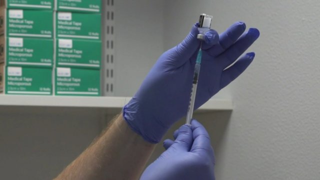 Person fills a syringe