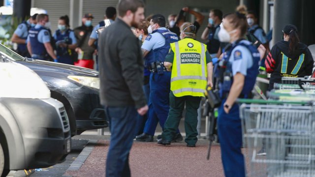 Police and ambulance staff attend a scene outside an Auckland supermarket,