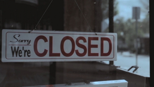 A closed sign in a business's window.